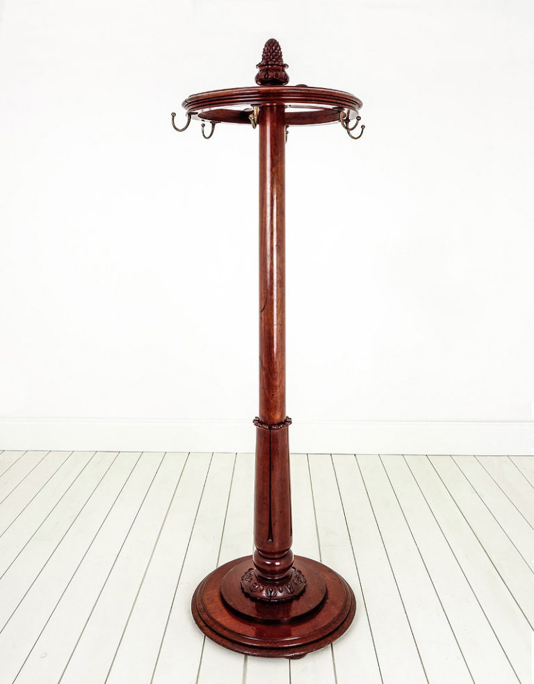 Antique mahogany revolving coat stand, circa 1890.