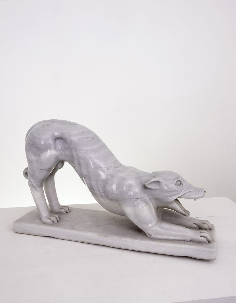 Large cat-fox like creature carved from a single piece of marble