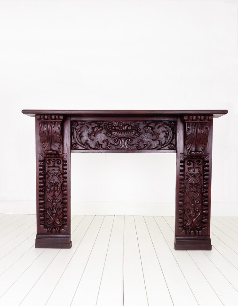 Very large antique mahogany carved fire surround.