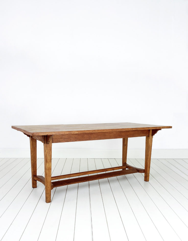 A large oak Arts & Crafts style refectory table.