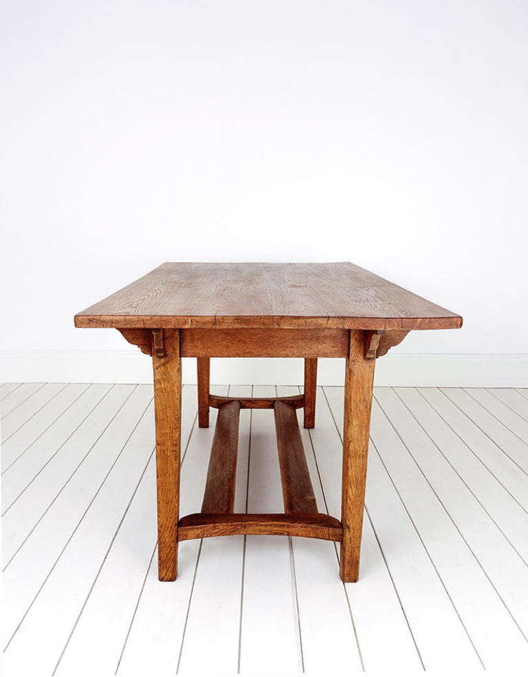 A large oak Arts & Crafts style refectory table.