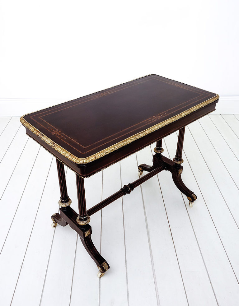 Ebonised antique fold over card table with gilt brass mounts and inlaid decoration. English circa 1880.