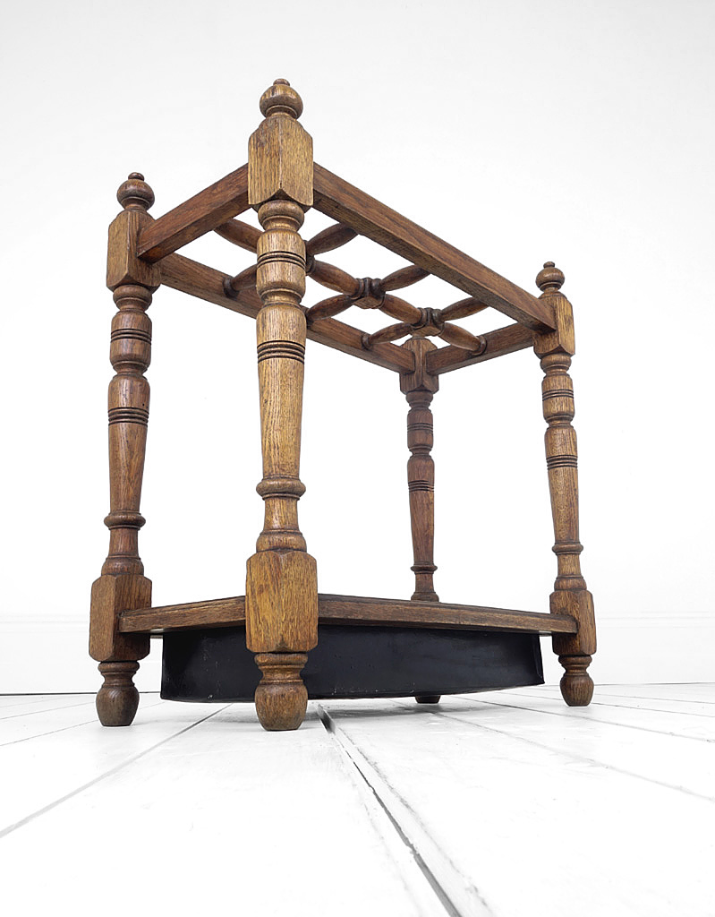 Oak umbrella stand English circa 1900. Sectional top with eight compartments.