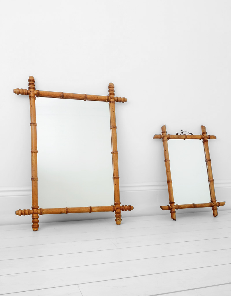 A pair of near matching French faux bamboo mirrors.