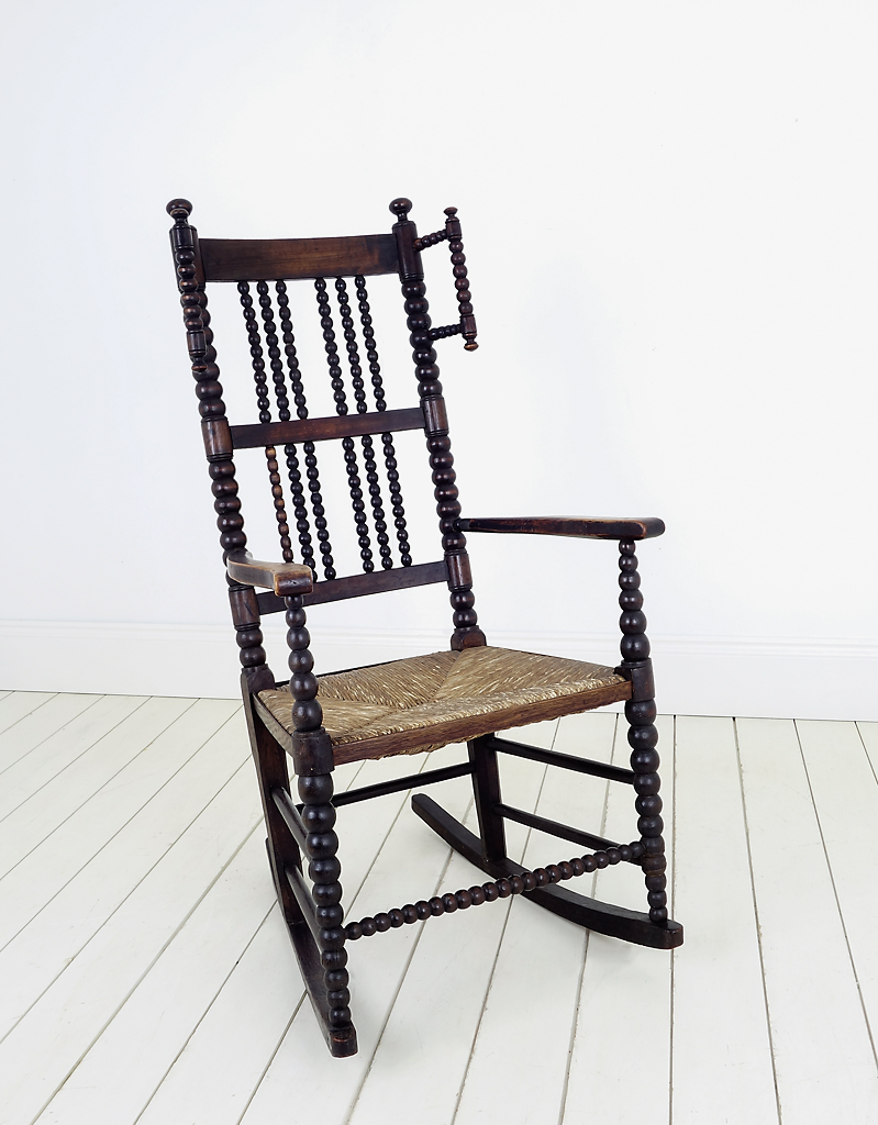 A Lancashire Bobbin Rocking Chair with wool winders.